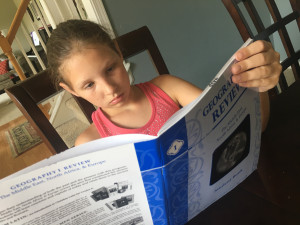 Girl Reads Geography Book
