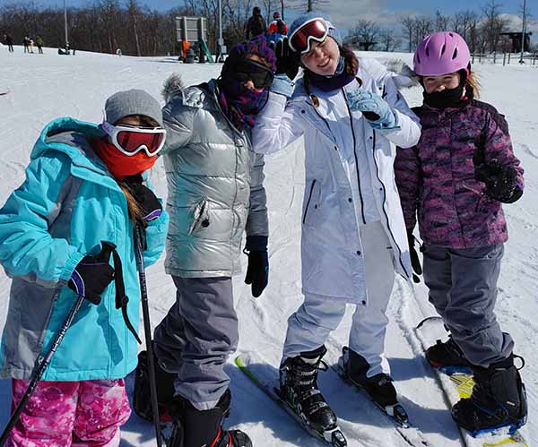 The Celebi family enjoy a ski trip together.