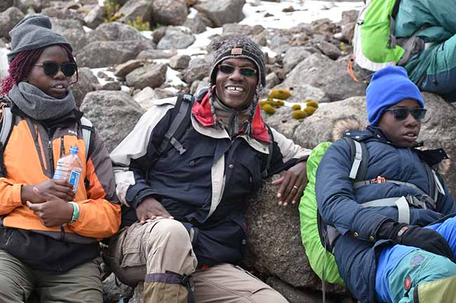 Taking a well-earned break on the climb up Mount Kenya.