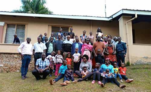 Uganda families pose for a photo at a parents conference.