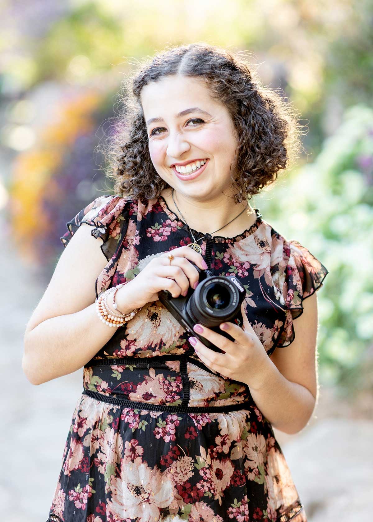 Isabelle holding a camera